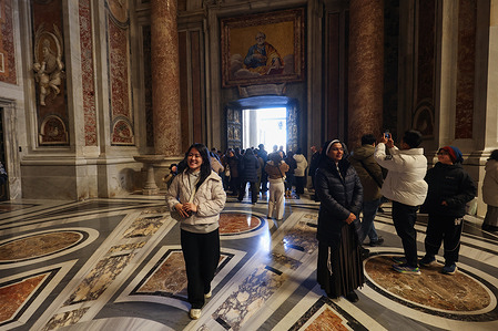 Pilgrims from all over the world perform the ritual of crossing the Holy Door on the first day of the opening of Pope Francis, in St. Peter's Basilica in the Vatican City in Rome.