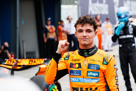 Lando Norris of Great Britain celebrates in pit lane after taking pole position ahead of the F1 Grand Prix of Australia at the Albert Park Grand Prix Circuit.