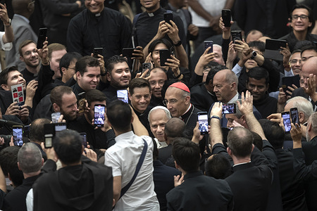 Pope Leo XIV leaves at the end of the meeting with members of the Roman clergy in the Paul VI hall.