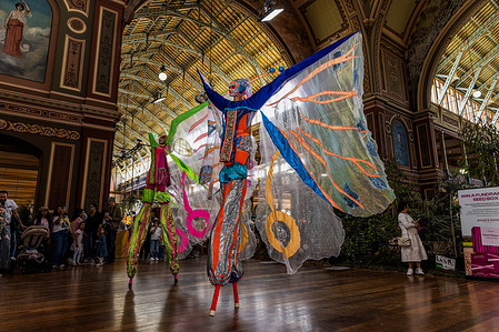 Performers inside the Royal Exhibition Building during the Melbourne International Flower and Garden Show. Visitors attend the Melbourne International Flower and Garden Show at the Royal Exhibition Building and Carlton Gardens in Melbourne, Australia, as the annual event showcases horticulture, garden design and outdoor living displays.