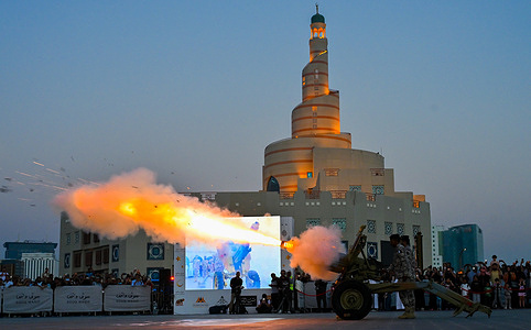 Members of the Qatari Armed Forces fire the Ramadan cannon marking the end of the daily fast on the fifth day of the holy month of Ramadan at traditional market. The Cannons are traditionally fired at various locations across Qatar each day during Ramadan to mark the breaking of the fast.