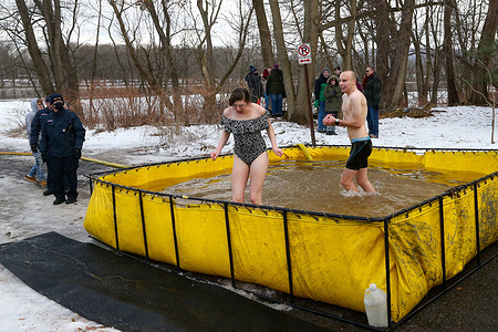 People participate in the annual Lewisburg Polar Bear Plunge. Proceeds from the event benefit Lewisburg Neighborhoods, which works to revitalize downtown Lewisburg.