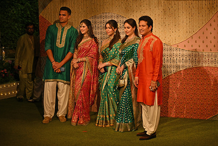 Former Indian cricketer Sachin Tendulkar (extreme right) pose for a photo alongside his wife Anjali Tendulkar (2nd right), daughter Sara Tendulkar (c), daughter in law Saaniya Chandhok (2nd left) and son Arjun Tendulkar (extreme left) as they arrive at Ganesh Chaturthi celebration organised by the Ambani family at their residence Antilia.