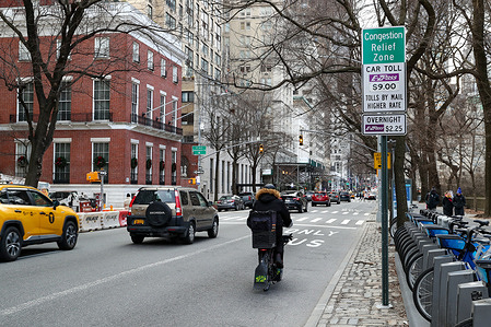 Traffic travels south on Fifth Avenue into New York City's Congestion Relief Zone. New York City's congestion pricing program, which charges most drivers $9 to enter Manhattan below 60th Street, went into effect at midnight.