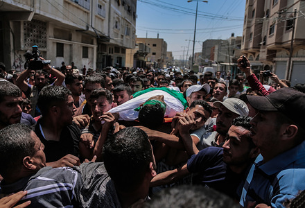 (EDITOR’S NOTE: Image depicts death)
Palestinian mourners carry the body of Ahmed Mohammed, during the funeral procession.
Palestinian, Ahmed Mohammed al-Qara, 23 received his last farewell in the southern Gaza Strip town of Khan Yunis, he was wounded by a live bullet in the abdomen during the "Al-Awda al-Kobra" demonstration in Khan Younis on 26th Jul 2019.