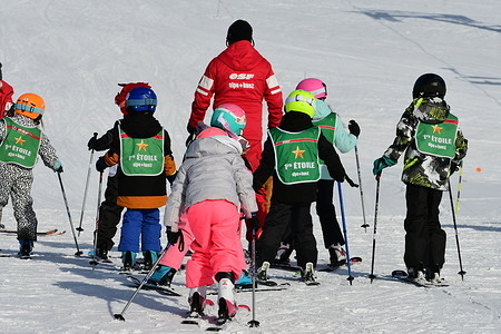 Children and ski instructor seen at the ESF ski school in the Alpe d'Huez ski area.