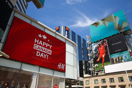 A "Happy Canada Day" LED display seen outside the H&M store as the city prepares to celebrate 152th Canada Day in Toronto.