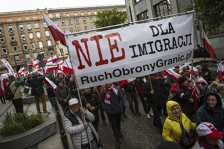 Protesters hold a banner saying "No to Migration" as they take part in an anti-migration protest. Nationalists gathered to take part in a protest that was called "March Against Migration". The march was organized by the Border Defense Movement (Ruch Obrony Granic) organization and held under the slogan “Stop the wave of mass migration from alien cultures". The protesters demand deportation of illegal migrants and tighten border controls with Germany which the organizers accuse of sending to Poland illegal migrants who were detained on German soil. Protesters shouted slogans like “This is Poland!”, “Muslim migrants are not welcome here!” and other anti-emigrant slogans some of which had a clearly xenophobic tone.