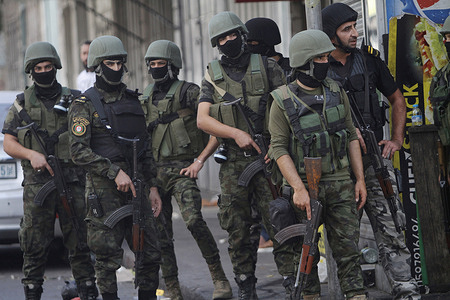 Soldiers of the Palestinian security forces take position during the clashes in the city of Nablus in the occupied West Bank. The Palestinians clashed with the Palestinian security forces while protesting the arrest of two members of the Islamic resistance movement Hamas.