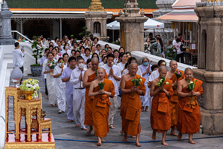 Buddhist monks and Buddhist devotees pray while circling around the temple during the Vesak day celebration at Wat Pho. Vesak Day or Vesakha Bucha Day is the day that commemorates the birth and enlightenment to Nirvana, and death of Buddha in the Buddhists faith.