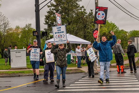 Machinists Union members hold placards during the demonstration. Thousands of machinist union workers at aerospace company Pratt & Whitney have gone on strike following failed contract negotiations.
