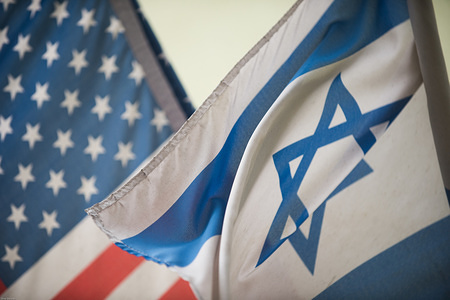 An United States of America and Israel flags seen at the Jewish quarter in Krakow.