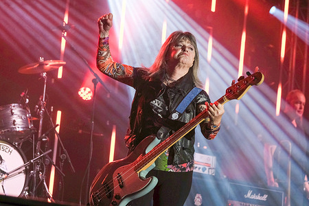 American singer, bass guitarist, songwriter and actor Susan Kay Quatro known professionally as Suzi Quatro performs live on stage at Wickham Festival.