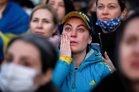 A woman with a tears in her eyes is watching the online concert. Ukrainians living in Ankara gathered in Ulus Square to watch the solidarity online concert in many countries of the world such as Berlin, London, Milan, Prague, Bratislava, and Toronto.