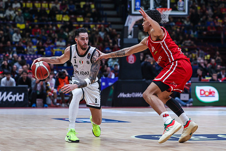 (L-R) Luca Vildoza of Virtus Olidata Bologna and Quinn Ellis of EA7 Emporio Armani Milano are seen in action during LBA Lega Basket A 2025/26 game between EA7 Emporio Armani Milano and Virtus Olidata Bologna at Unipol Forum. Final score EA7 Emporio Armani Milan 74 | 63 Virtus Olidata Bologna