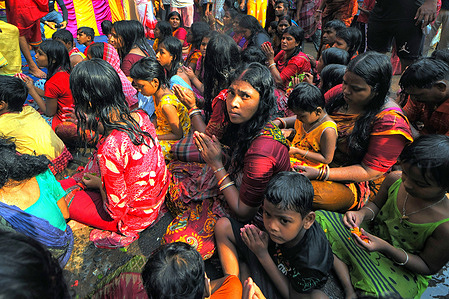Hindu people seen praying while seated on ground as a traditional ritual worship of Devi Sheetala As per Hindu mythology Devi sheetala is being worshipped as she cures smallpox's, sores, ghouls, pustules and diseases. Hence Hindu people observe Fast for the whole day and doing different traditional practices like Dandi (Lying on Ground) and put burning Fire Pot on their heads while worshiping to Devi sheetala for betterment of their family members.