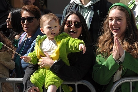 Revelers celebrate the New York City St. Patrick's Day Parade on Fifth Avenue. The annual parade commemorating Irish culture, draws police officers, firefighters, politicians, bands and revelers to midtown Manhattan, New York City.