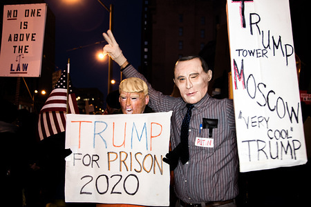 DAYTON, UNITED STATES - DECEMBER 17 2019: Protesters holding placards dressed as President Donald Trump (left) and President Vladimir Putin (right) during a rally supporting the impeachment of President Donald Trump.