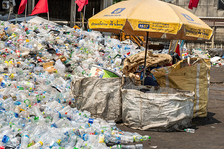 A view of a massive heap of discarded plastic bottles outside a local warehouse. Waste sorters are a crucial part of the recycling system. Sorting, weighing, and preparing materials for resale to larger recycling companies or factories thus contributing to the circular economy. Despite their essential role in managing plastic waste and limited formal infrastructure these frontline workers often lack labor protections, social recognition and economic stability.