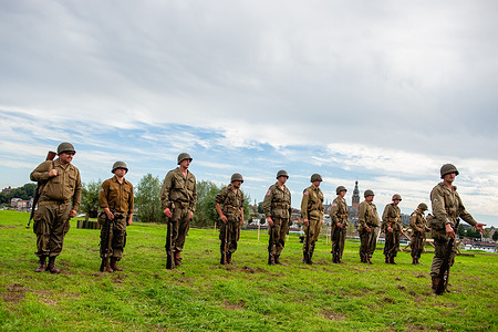 WW II reenactors are seen performing for the audience. This month marks 82 years since the troops of the American 82nd Airborne Division crossed the Waal River in Nijmegen to liberate the city from the German occupiers. A World War II encampment was recreated on the riverbank, where reenactors took visitors back in time with living history.