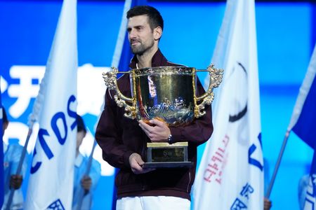 Novak Djokovic of Serbia poses with the trophy during the medal ceremony after he won the Men's Singles final match against Alex De Minaur of Australia ( not in view) on day seven of China Open at the National Tennis Center. Novak Djokovic won after Alex De Minaur was forced to retire due to injury in the second set. Final score: 7–6(3), 0–1 (ret.)