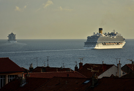 The MSC Seaside (L) and the Costa Firenze (R) leave the French Mediterranean port of Marseille.