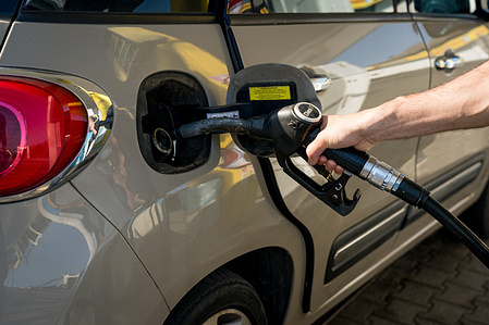 A person is seen refueling a car at a petrol station. Prices of diesel, gasoline and gas have been spiking in Italy following the closure of the Hormuz strait by Iran in response to the attacks launched by the USA and Israel, forcing the Italian government to put in place measure to curb the prices of fuel and energy, while some stations are running out of diesel.