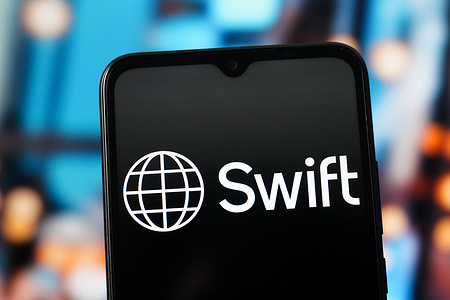 In this photo illustration, the Society for Worldwide Interbank Financial Telecommunication (Swift) logo is seen displayed on a smartphone screen.