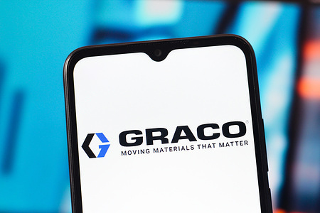In this photo illustration, the Graco logo is seen displayed on a smartphone screen.