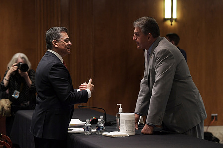 US Secretary Department of Health and Human Service, Xavier Becerra talks with Senator, Joe Manchin (D-WV) before the hearing examining the proposed budget estimates and justification for ‘FY22 Budget for the Department of Health and Human Service’, at Dirksen Senate Office Building/Capitol Hill.