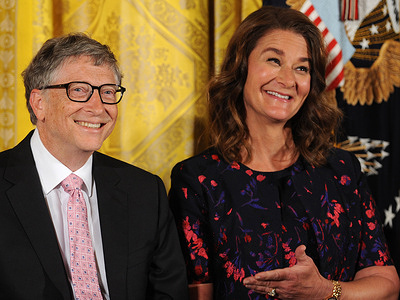 Bill and Melinda Gates react as former U.S. President Barack Obama gives remarks before presenting them with the Presidential Medal of Freedom in a ceremony in the East Room of the White House.