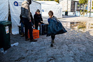 Hatay, Turkey - 14/02/2023 16:20:34: Children are seen carrying relief goods near a relief shelter Turkey and Syria have experienced the worst earthquakes to strike the region in almost a century. A 7.8-magnitude quake struck southeastern Turkey, which was followed by a second quake of 7.7 in northern Syria. More than 30,000 people are reported to have died due to the quakes, and the death toll is still rising.