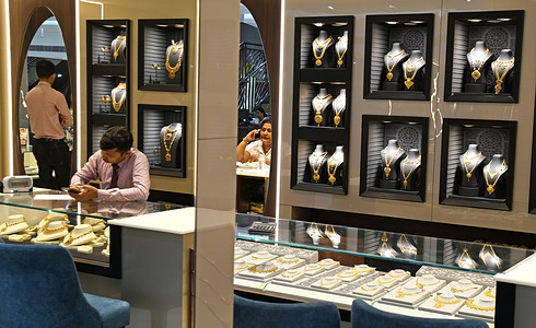 Gold jewellery is kept on display at Kalyan jewellers store in Mumbai. Price of gold rose to all time high due to global uncertainties making the buyers delay their purchase of the yellow metal till price stabilize.