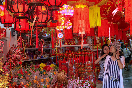 Ethnic Chinese women shop for Chinese New Year decorations ahead of the Lunar New Year of the Horse (specifically, the Fire Horse). Lunar New Year which begins on February 17, 2026, welcomes the year of the Horse, which will be celebrated by the Chinese around the world.