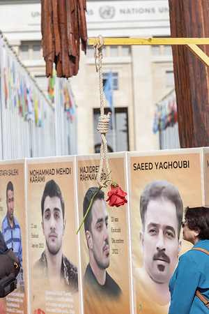 A symbolic noose with a red rose hangs at Place des Nations during the Geneva rally, as portraits of executed protesters including Mohammad Mehdi Karami, Majidreza Rahnavard, and Saeed Yaghoubi are displayed. At Place des Nations in front of the United Nation building, a large rally was organized by supporters of the Iranian opposition (NCRI and MEK) who honored victims of executions and massacres in Iran. The demanded urgent UN action to stop executions, hold Tehran accountable for crimes against humanity, and support Maryam Rajavi’s Third Option for democratic change in Iran.