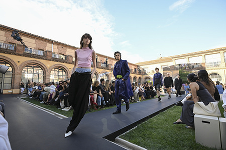 A model parades with Acromatyx design during the Mercedes Benz Fashion Week Madrid at Cibeles Palace in Madrid.