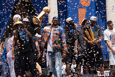 Karl-Anthony Towns and members celebrates with the championship trophy as confetti falls during the 2026 NBA Championship ceremony for the new York Knicks in New York City on Thursday, June 18, 2026.