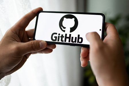 In this photo illustration a GitHub logo seen displayed on a smartphone.