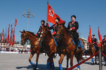 The Kremlin Equestrian School's horsemen with Soviet Union flags seen during performance dedicated to Victory Day 9 May at the VDNKh. The Kremlin Equestrian School was founded in 2006 under the aegis of the Moscow Kremlin Commandantís Service of the Federal Guard Service of the Russian Federation.