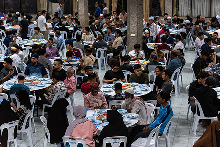 Muslims seen eating their food during the first day of Ramadan at the Islamic Centre in Bangkok. Ramadan is the ninth month of the Islamic calendar, and it is a month of fasting, prayer, and meditation for Muslims all over the world.