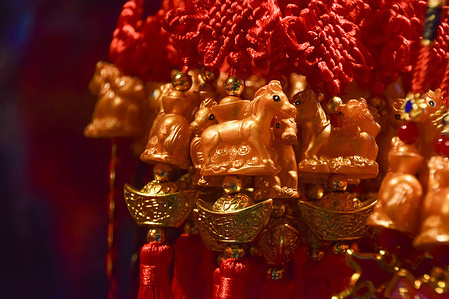 Horse lucky charms are seen on sale at a store in Chinatown ahead of the Chinese New Year, also known as the Lunar New Year. This year is the Year of the Horse.