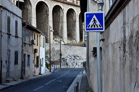 A pedestrian crossing road sign is seen in Marseille.