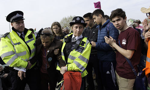 Activist is seen being arrested by police officers after refusing to head to Marble Arch during the Extinction Rebellion Strike in London.

Environmental activists from the Extinction Rebellion movement protest for the fourth consecutive day at Waterloo Bridge in London. Activists parked a lorry on the bridge blocking the street. Police have been arresting protesters that refuse to head to Marble Arch. Extinction Rebellion is demanding the UK government take immediate action on climate change, including reducing carbon emissions to zero by 2025 and a setting up a People's Assembly.