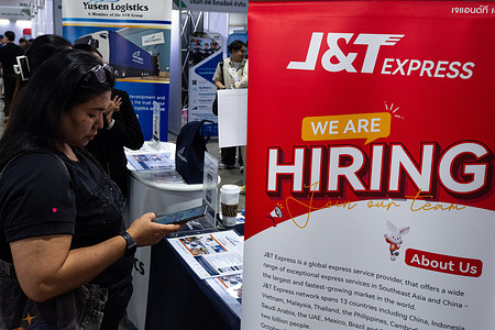 A visitor look at the job hiring placard during the event. More than 500,000 job vacancies from Thailand and International companies are available for job seekers at the Job Expo Thailand 2026 that was held by the Thailand Ministry of Labour at Queen Sirikit National Convention Center in Bangkok.