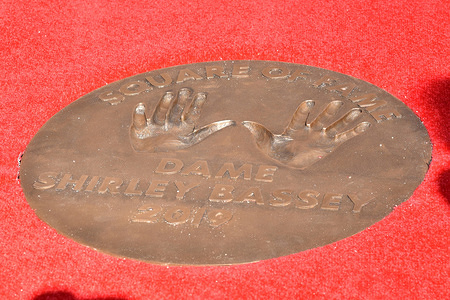 Handprints of Dame Shirley Bassey in the form of a bronze plaque in the ‘Square of Fame’ at The SSE Arena, Wembley, in Wembley Park in London, to mark 60 years of entertainment at London’s iconic music and entertainment venue.