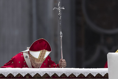 Pope Leo XIV Kisses the altar at the end of a Mass for the Solemnity of Pentecost in ST. Peter's Basilica at the Vatican.