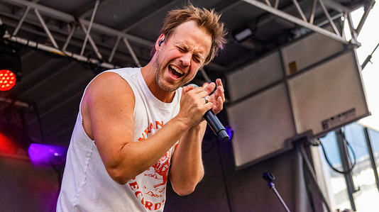 Canadian country music artist Dan Davidson performs during the Canada Day Celebrations at the Ice District Plaza.