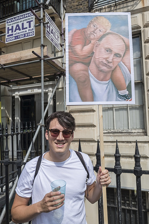 An anti Trump protester holds a sign showing Trump being carried like a child by the Russian President, Putin.
Protest against US President Donald Trump’s visit to the UK in central London.