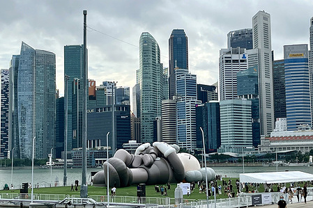 A 42m-long inflatable artwork of Mickey Mouse-like figure by artist Kaws is seen at The Float at Marina Bay in Singapore. 
The American artist Kaws whose real name is Brian Donnelly is popular for his toys, sculptures and paintings.