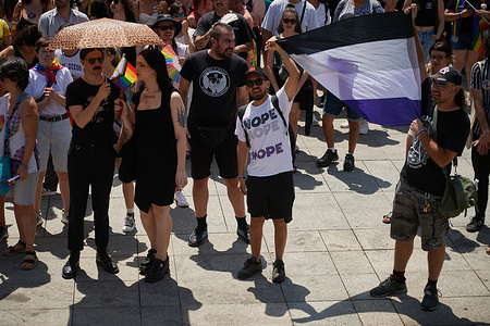 Demonstrators hold a flag during the Gay Pride march. Hundreds of people participated in the demonstration held to mark International LGBTI+ Pride Day.